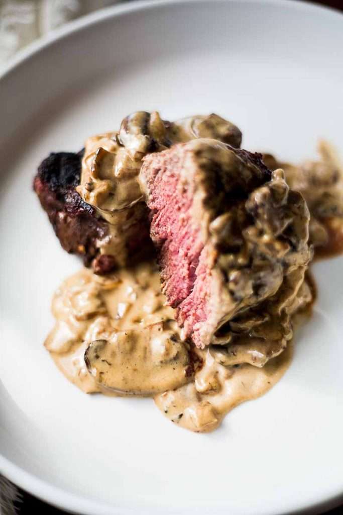 Medium Rare Steak with Whiskey Mushroom Cream Sauce